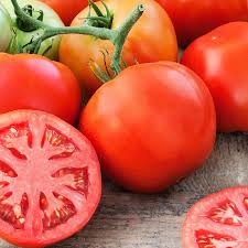 Fresh, ripe MIgardener Delicious Tomato showcasing vibrant red color and smooth skin, perfect for salads and cooking.