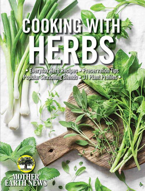 Mother Earth News magazine titled "Cooking with Herbs" 1st Edition, featuring a cover with herbs and cooking ingredients.