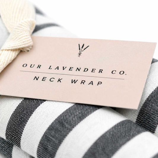 Lavender neck wrap heating pad by Our Lavender Co, 28x4 inches, made of soft fabric, designed for soothing neck and shoulder relief.