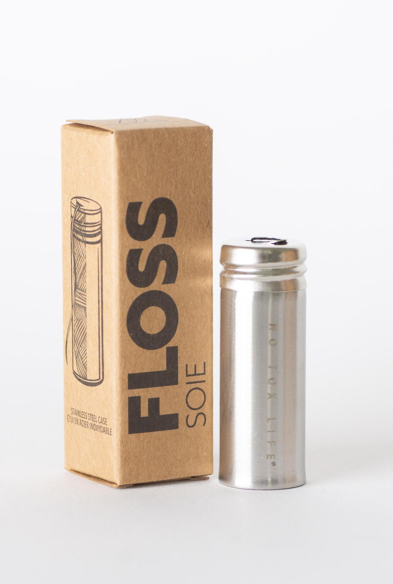 Charcoal dental floss in stainless steel holder from NO TOX LIFE, eco-friendly and reusable oral hygiene product.