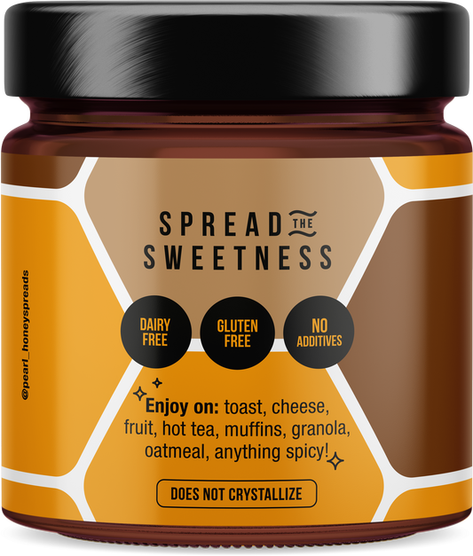 Creamed cacao honey by Pearl Honey Spreads, smooth and rich with visible cacao swirls in a jar.