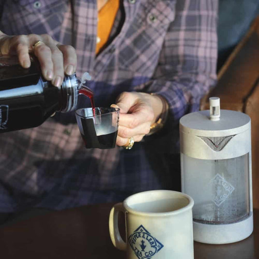 Piper Press brewing device by Piper and Leaf Tea Co., stainless steel press for tea steeping with a sleek design.