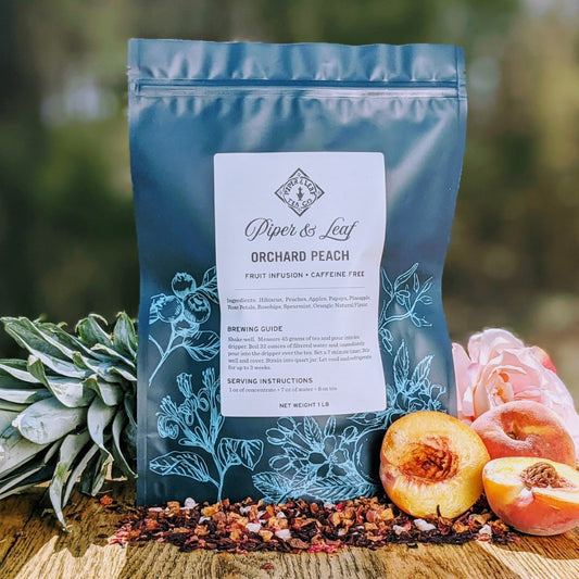 Piper and Leaf Tea Co. Orchard Peach loose tea in a pound bag, featuring dried peach tea leaves and natural fruit flavor.