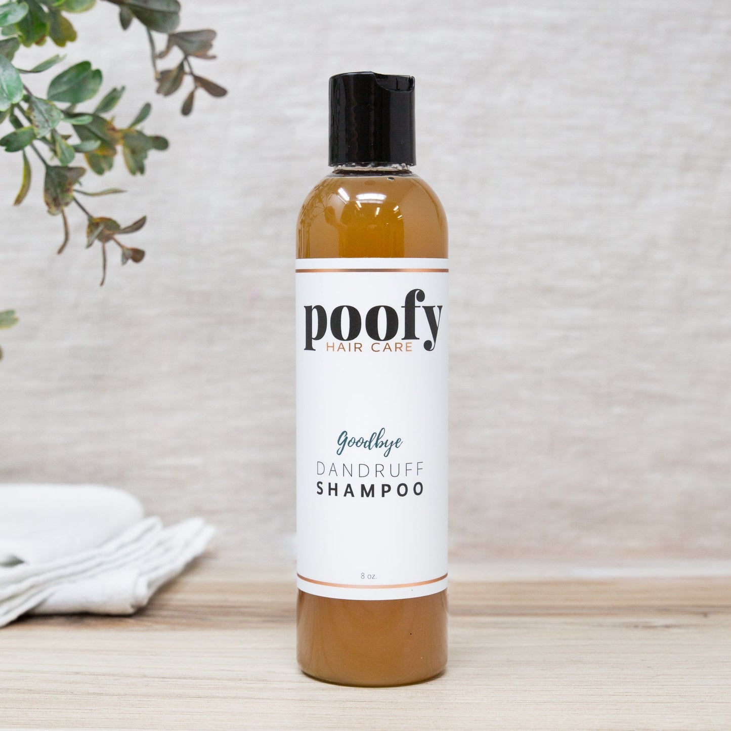 Poofy Organics Goodbye Dandruff Treatment Shampoo bottle with label, natural hair care product for dandruff relief.