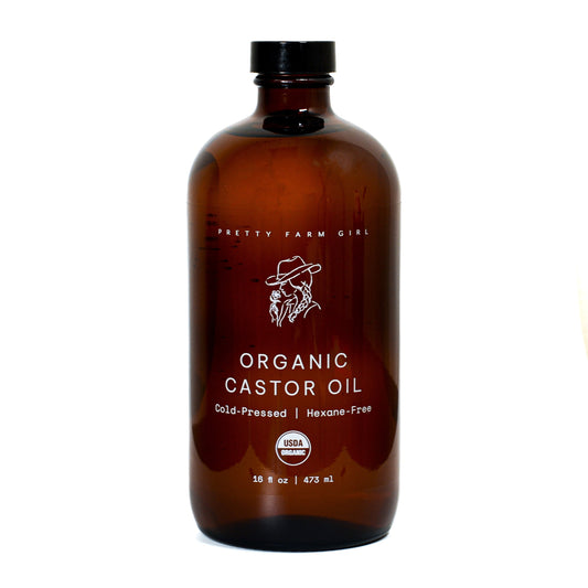 Organic Pure Castor Oil and cloth pack bundle by Pretty Farm Girl, featuring an 8oz bottle of castor oil and reusable cloth.