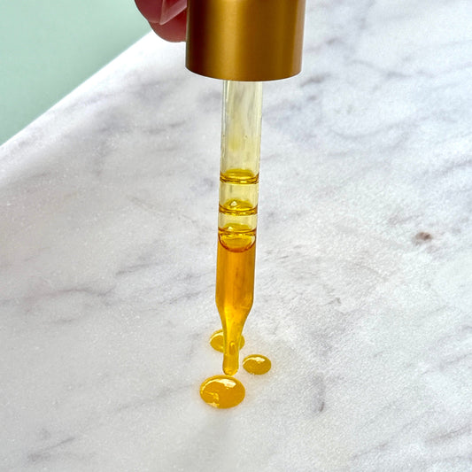 Clara & Fritz Tallow Shop Radiance Instant Glow Facial Serum in a sleek bottle with a dropper, showcasing its luminous skincare formula.