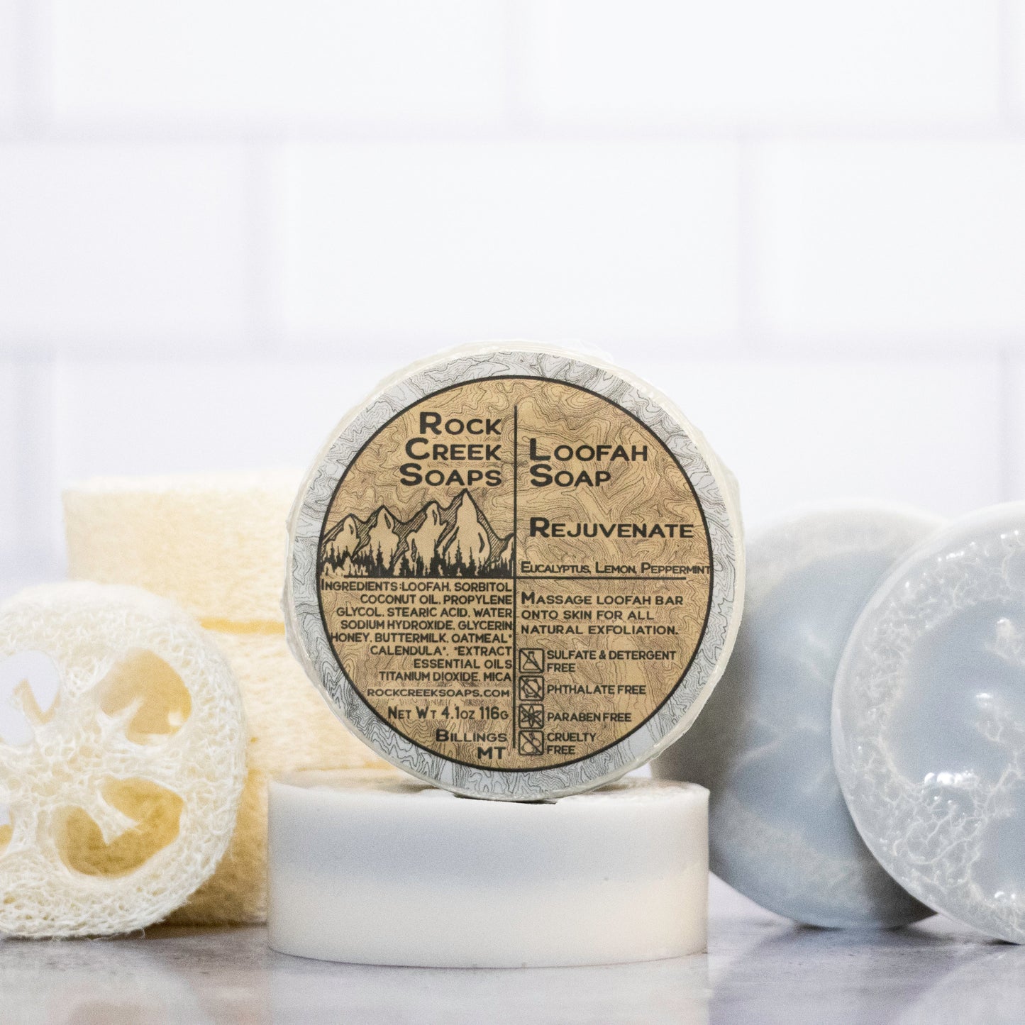 Rock Creek Soaps rejuvenating loofah soap with natural exfoliating loofah and gentle cleansing formula in a clear bar