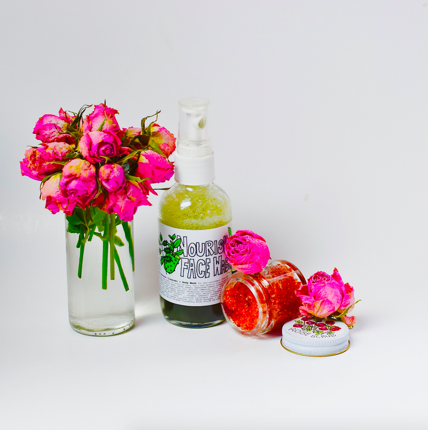 Plant Makeup Beach Rose Scrub jar with rose petals and natural ingredients, showcasing its textured exfoliating surface.