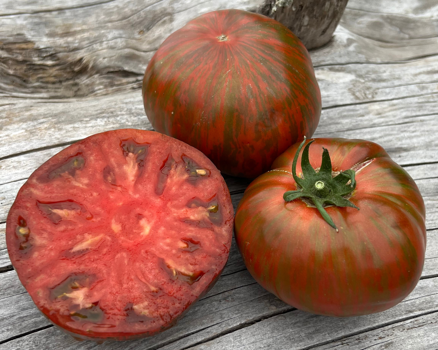 Packet of Seeds 'n Such Beefy Purple Tomato Seeds showing a colorful seed packet with purple tomato illustrations.