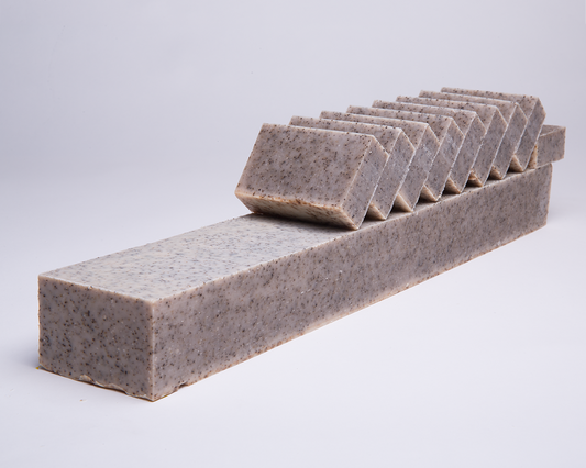 Bar of Soap for Sinners Peppermint Coffee Scrub soap showing a textured surface with peppermint and coffee ingredients visible.