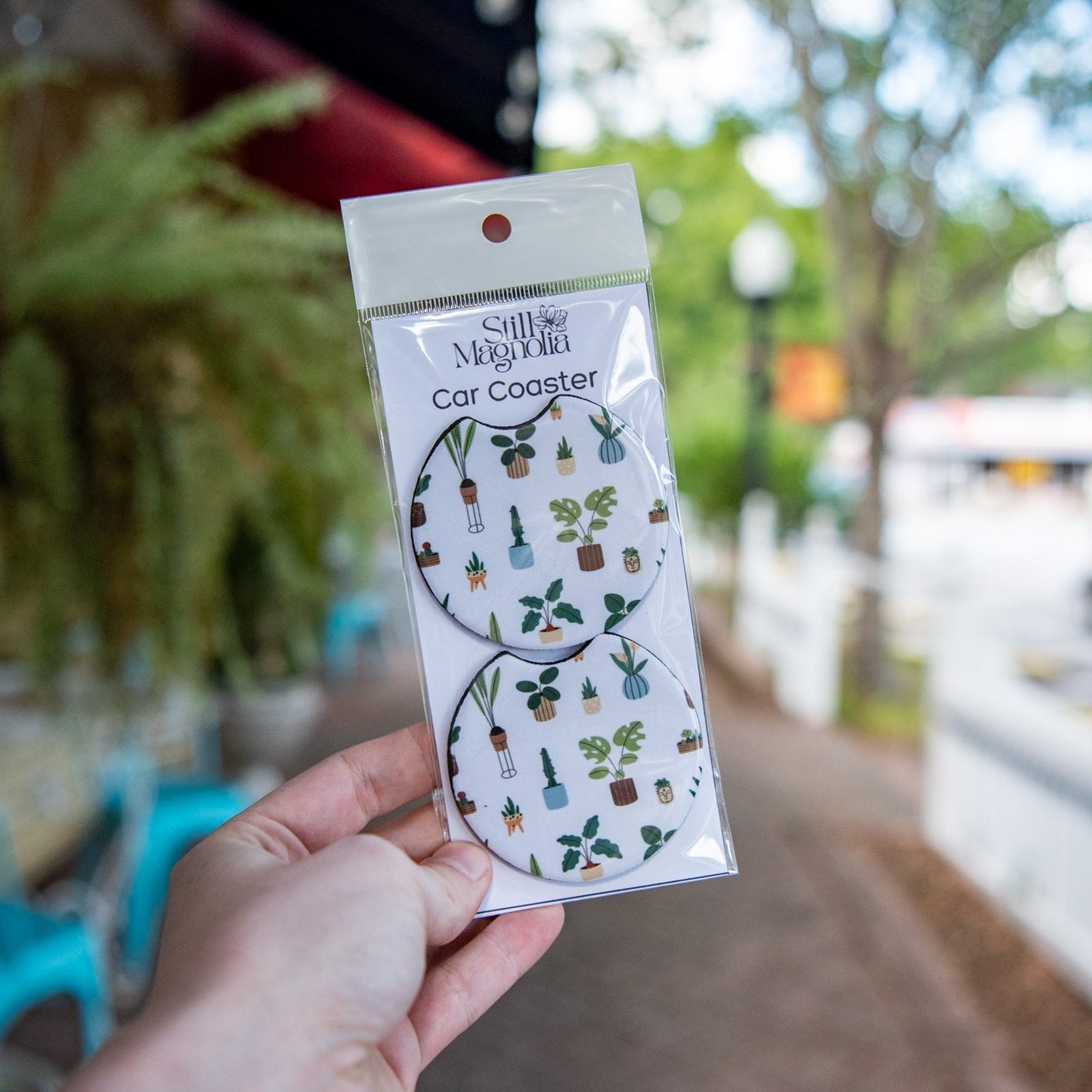 Still Magnolia car coaster with houseplant pattern, featuring a decorative design for protecting car surfaces from moisture.