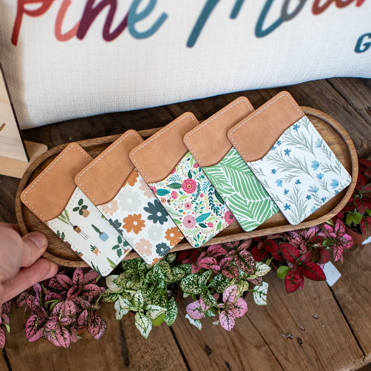 Still Magnolia Wildflower Whisper Pattern phone wallet with floral design and card slots, made of durable material.