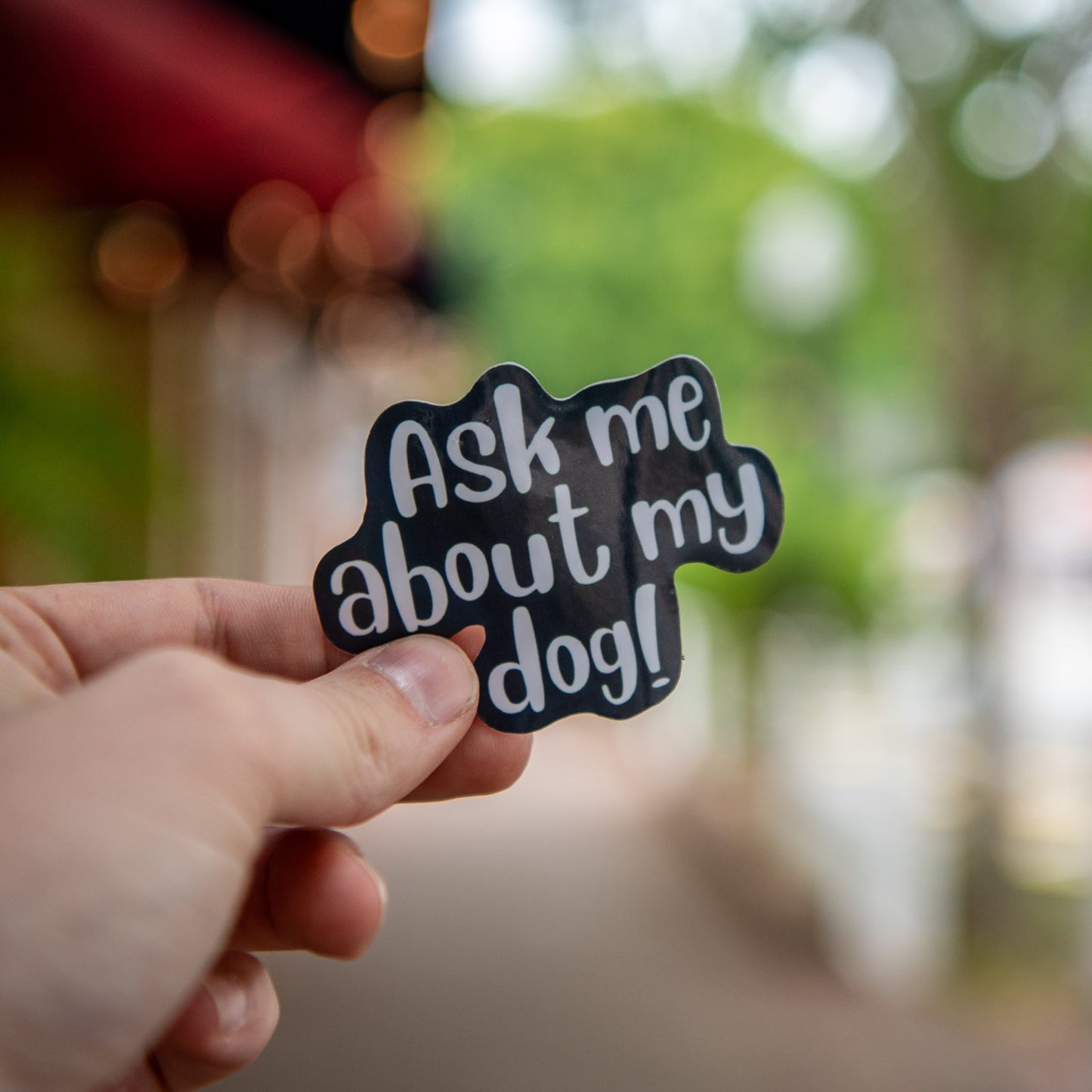 Still Magnolia Ask About My Dog sticker featuring playful dog illustration on a adhesive sticker.