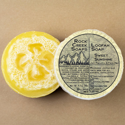 Rock Creek Soaps Sweet Sunshine loofah soap with a natural loofah sponge and bright yellow soap bar for gentle exfoliation.