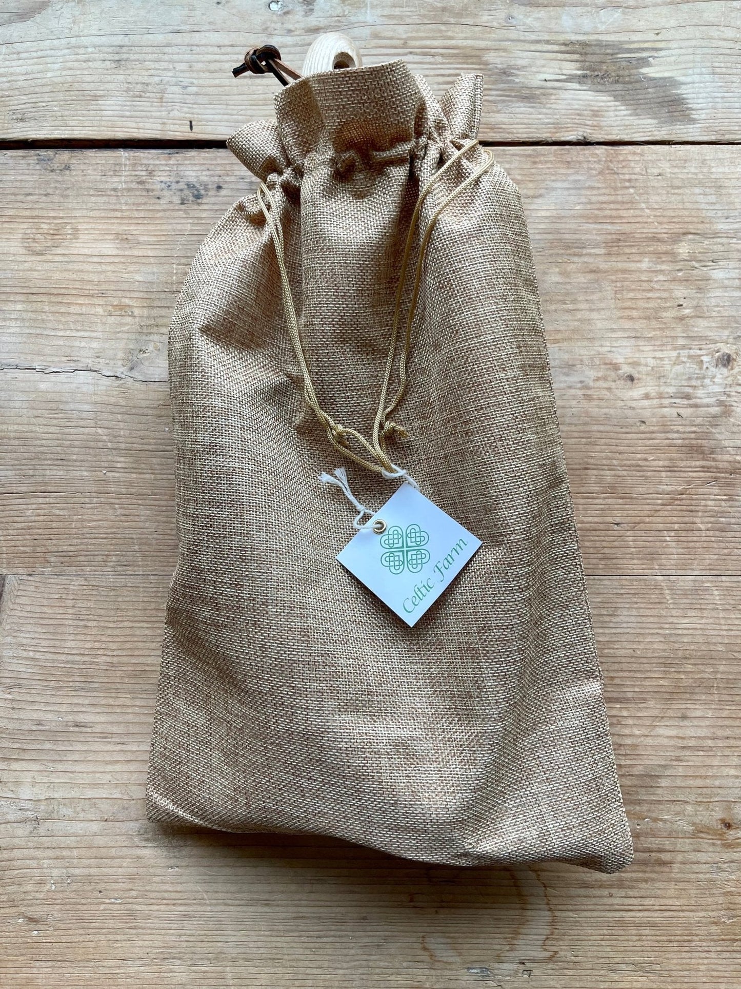 The Celtic Farm potter's tool set with three gardening tools inside a burlap gift box for potting and gardening.