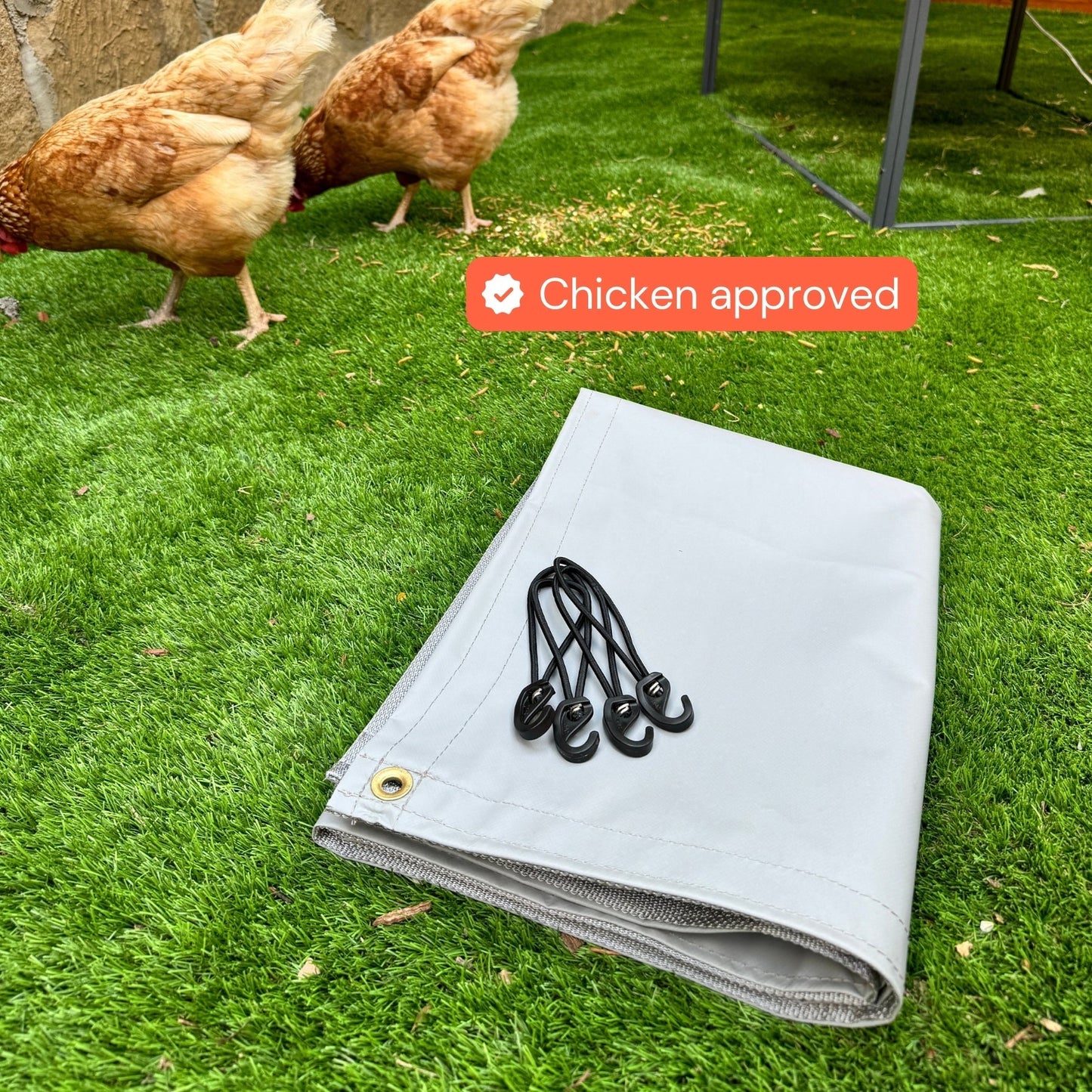 All-weather coop tarp from The Smart Coop draped over a chicken coop for weather protection and durability.