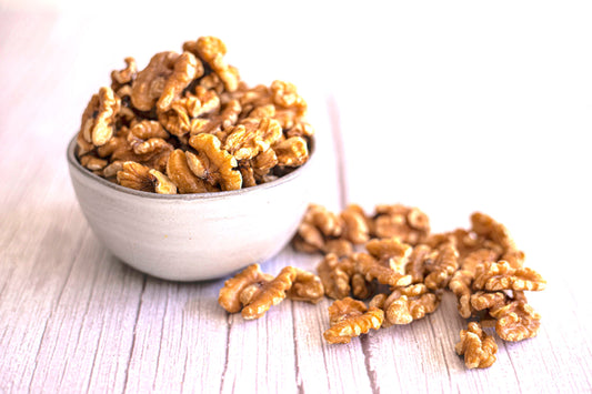 Organic Chandler walnuts from True California, showing a close-up of fresh, shelled walnuts in a 1-pound package.