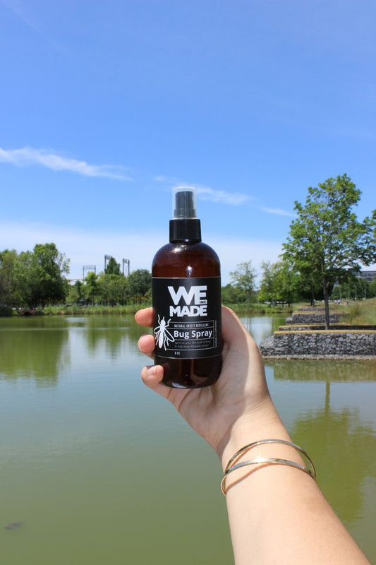 Natural insect repellent bug spray by WE Made, featuring a spray bottle with herbal ingredients for outdoor protection.
