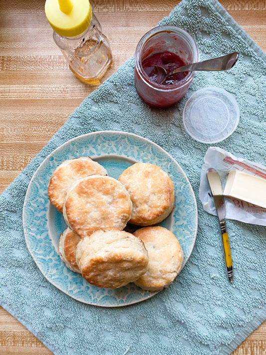 Buttermilk biscuit mix by WE Made showing a box of baking mix with golden-brown biscuits on the packaging