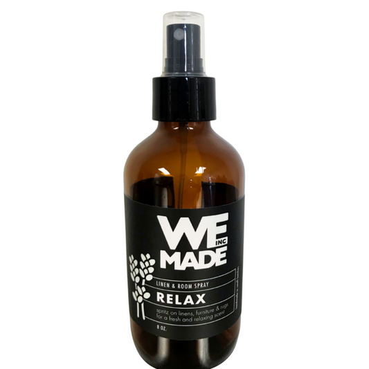 WE Made Relax Linen & Room Spray bottle with a sleek design, showcasing a calming scent for freshening linens and rooms.