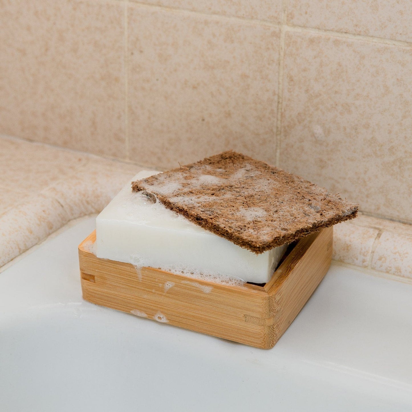 Natural coconut kitchen scrubber from ZeroWasteStore for eco-friendly household cleaning and scrubbing dishes.