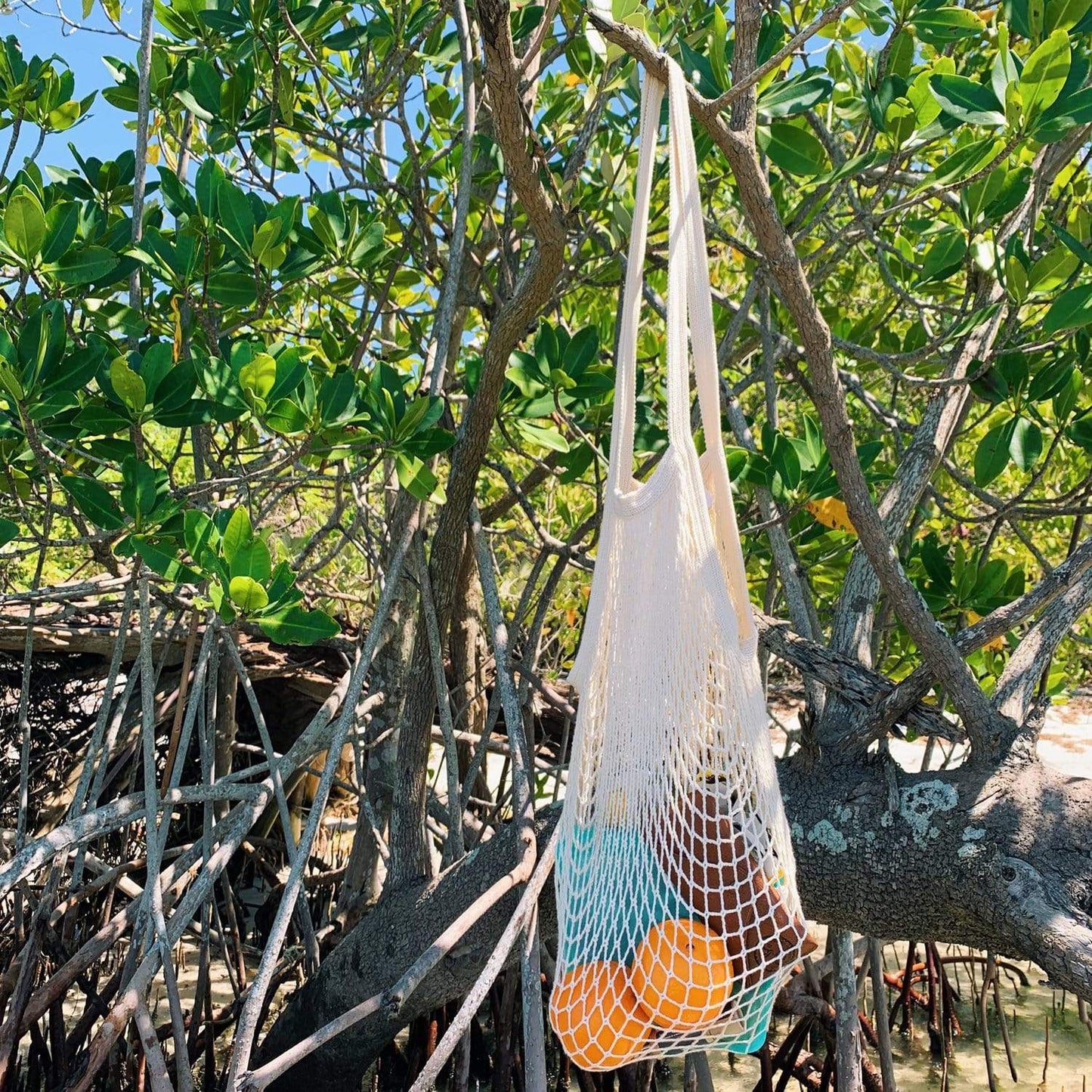 Organic cotton string shopping tote with mesh design, zero waste and plastic-free, eco-friendly market bag for shopping.