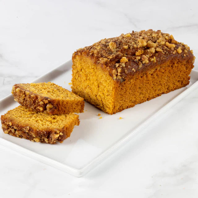 Slice of pumpkin streusel coffee cake from Beatrice Bakery, showing moist cake with caramelized streusel topping.