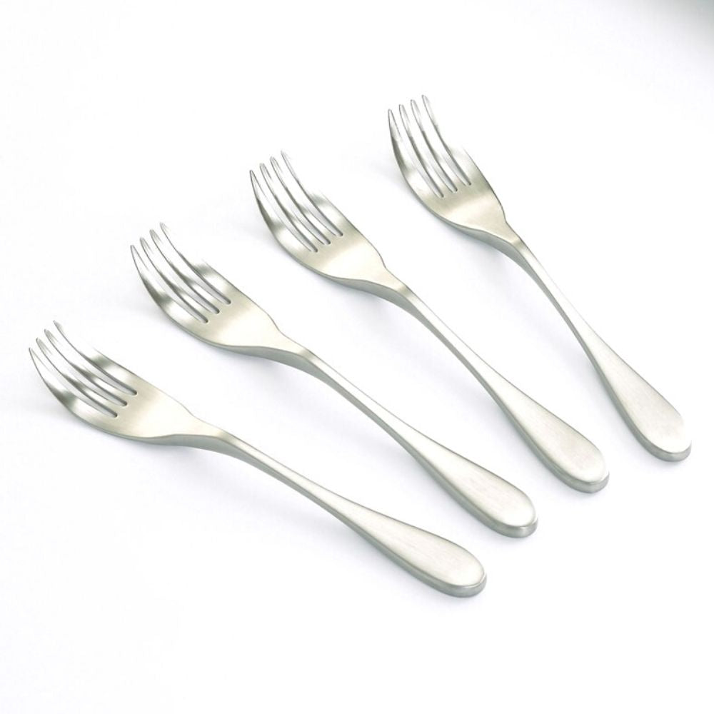 Set of four Knork Original dinner knives with ergonomic handles and stainless steel blades, displayed on a neutral background.