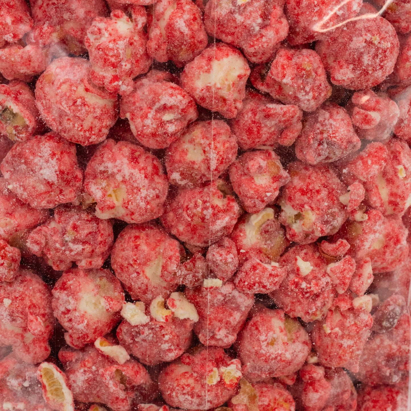 Strawberry Shortcake Popcorn by HR Poppin' Snacks in an 8 oz bag, showcasing pink and white popcorn with strawberry flavor accents.