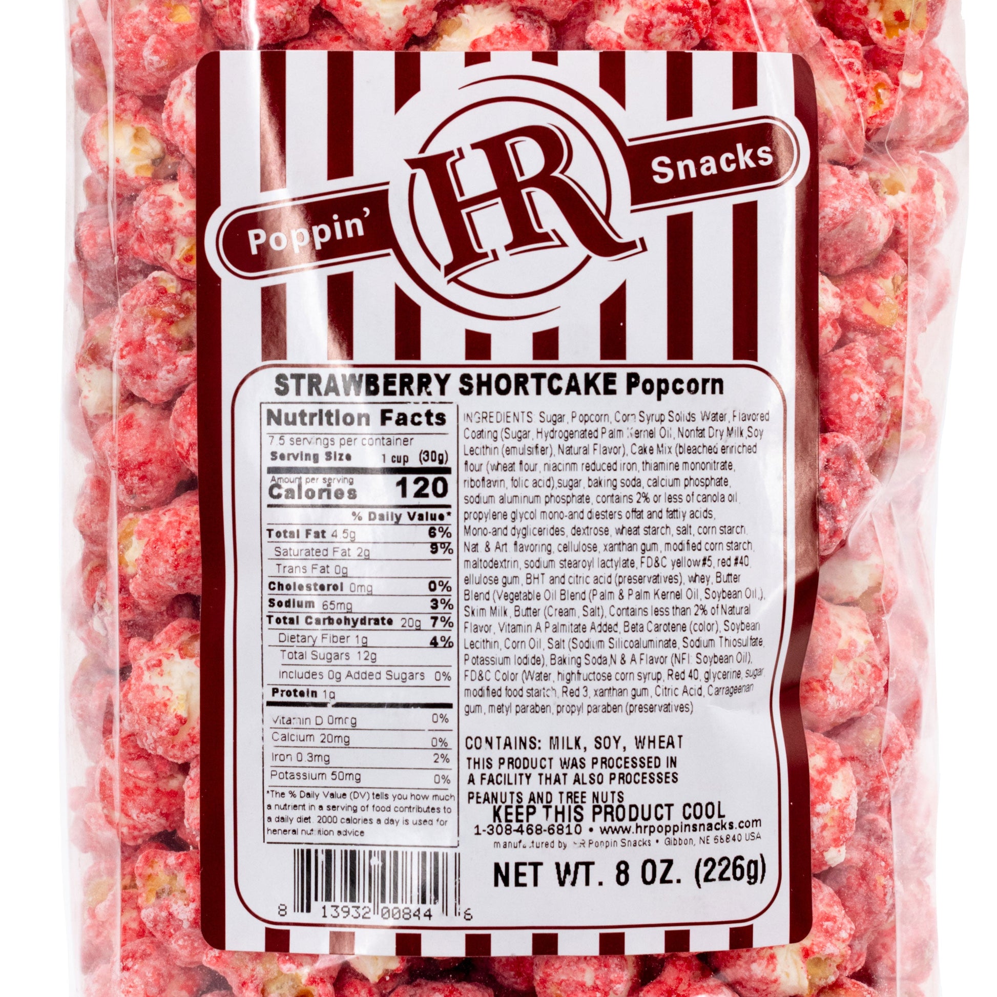 Strawberry Shortcake flavored popcorn from HR Poppin’ Snacks in an 8 oz bag, featuring pink popcorn with strawberry and cream coating.