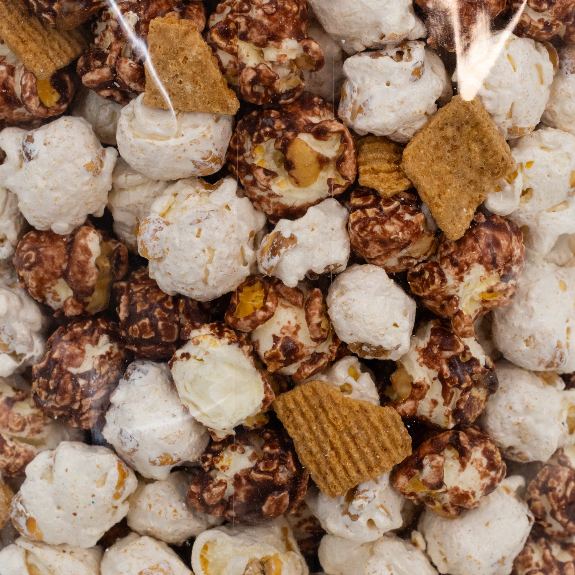 Sweet S'more popcorn in an 8 oz bag from HR Poppin' Snacks, featuring toasted marshmallow, chocolate, and crunchy popcorn.