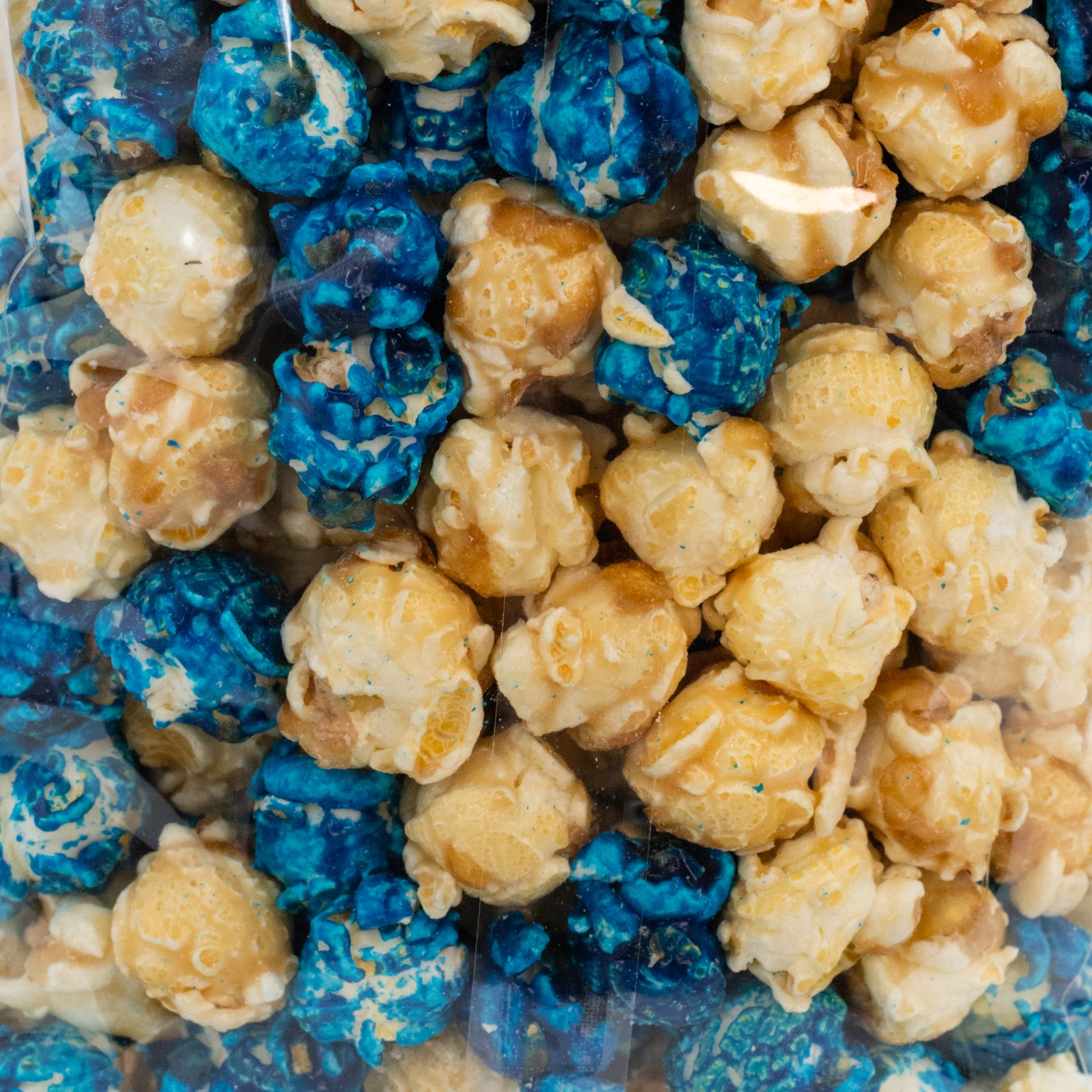 Blueberry muffin popcorn in an 8 oz bag by HR Poppin' Snacks, featuring blueberry flavor and crunchy popcorn texture.