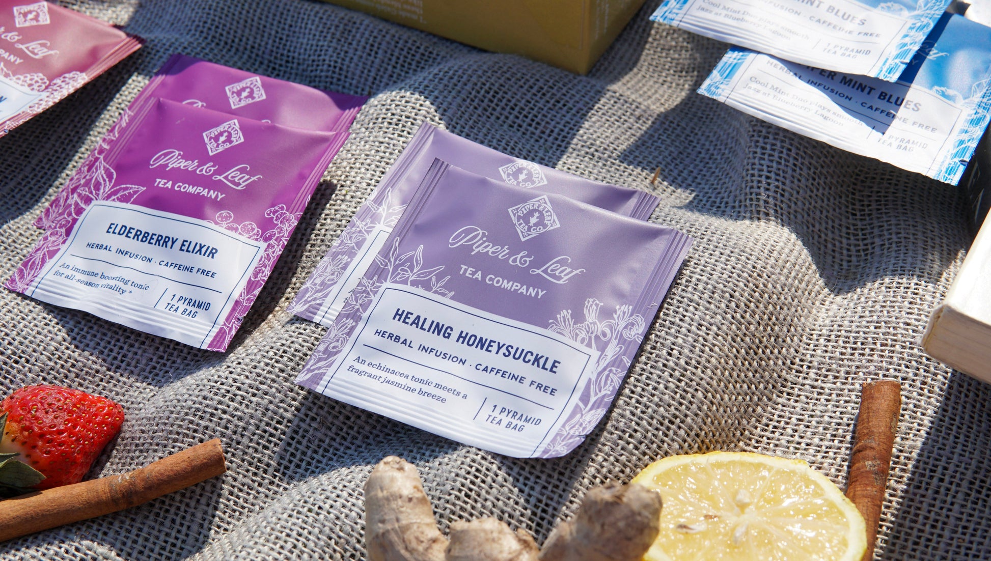 Box of 12 caffeine-free Piper and Leaf Tea Co. tasting flight tea bags, assorted herbal and fruit flavors, in individual packaging.