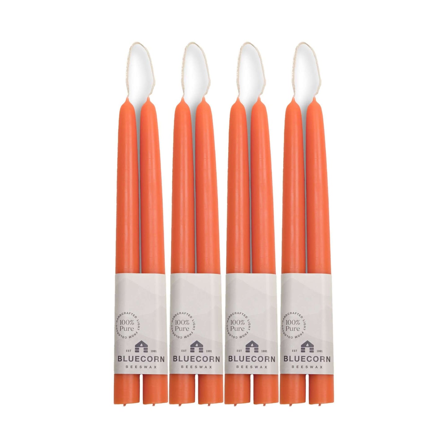 Set of 8 apricot pink beeswax taper candles from Bluecorn Candles, 10-inch tall, ideal for bulk gift or decor use.