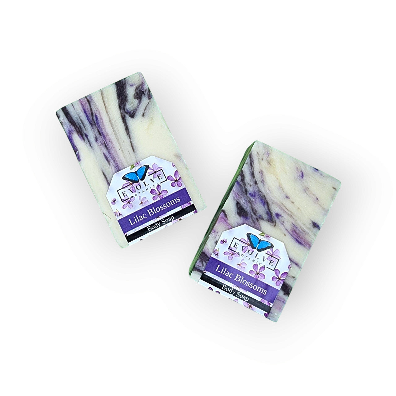 Evolve Botanica seasonal soap with lilac blossoms, featuring a floral soap bar with purple lilac flower accents and botanical packaging