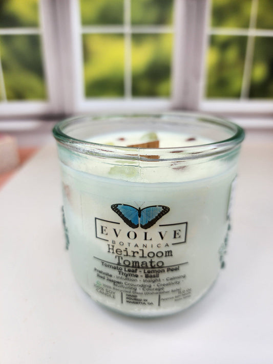 Evolve Botanica Rocks Candle with heirloom tomato scent, wood wick, prehnite and red jasper stones, soy wax candle on a neutral background.