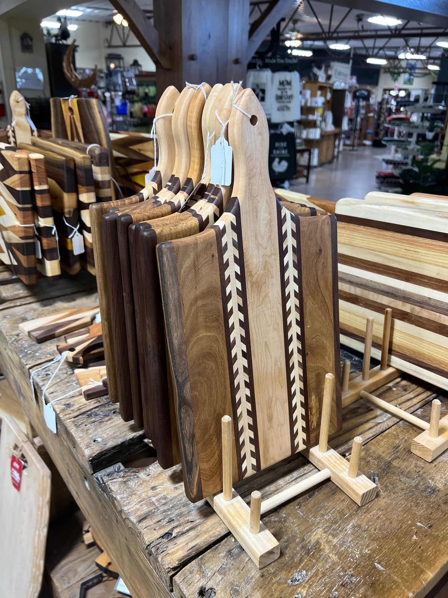 Amish handmade wheat inlay cutting board made of mixed hardwood with paddle shape, ideal for kitchen use.