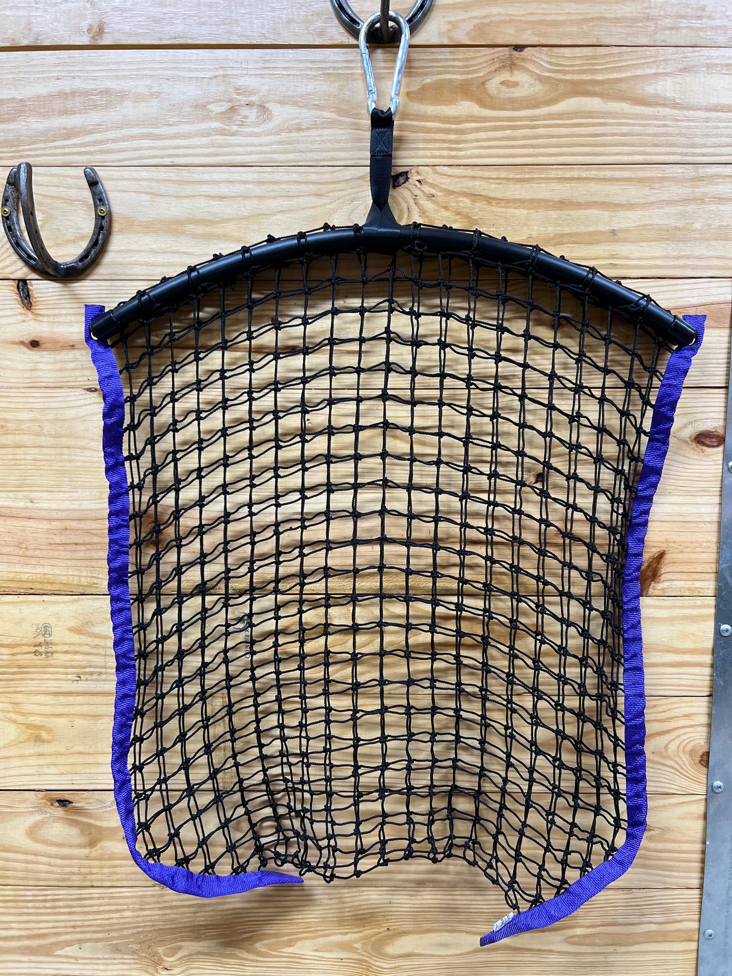 Purple regular haynet from Haylo Haynets, LLC with tightly woven mesh for safe hay storage and feeding.
