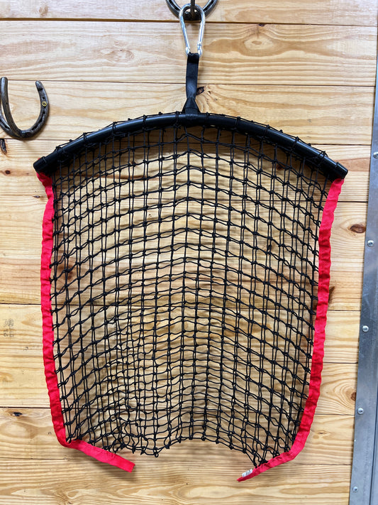 Red regular haynet from Haylo Haynets, LLC with tightly woven mesh for secure hay storage and easy feeding.