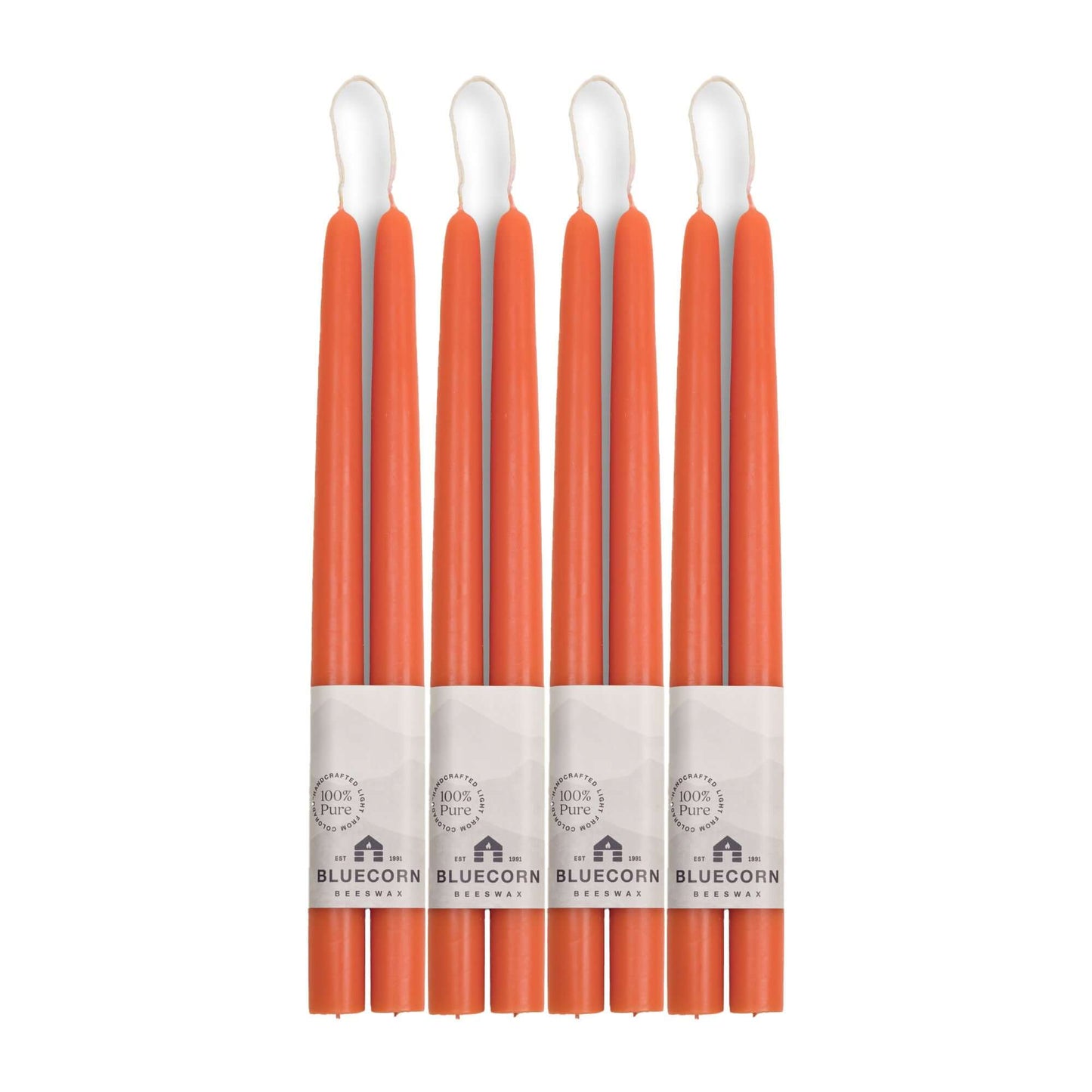 Set of 8 apricot pink beeswax taper candles from Bluecorn Candles, 12-inch tall, hand-dipped and ideal for bulk decorative lighting.