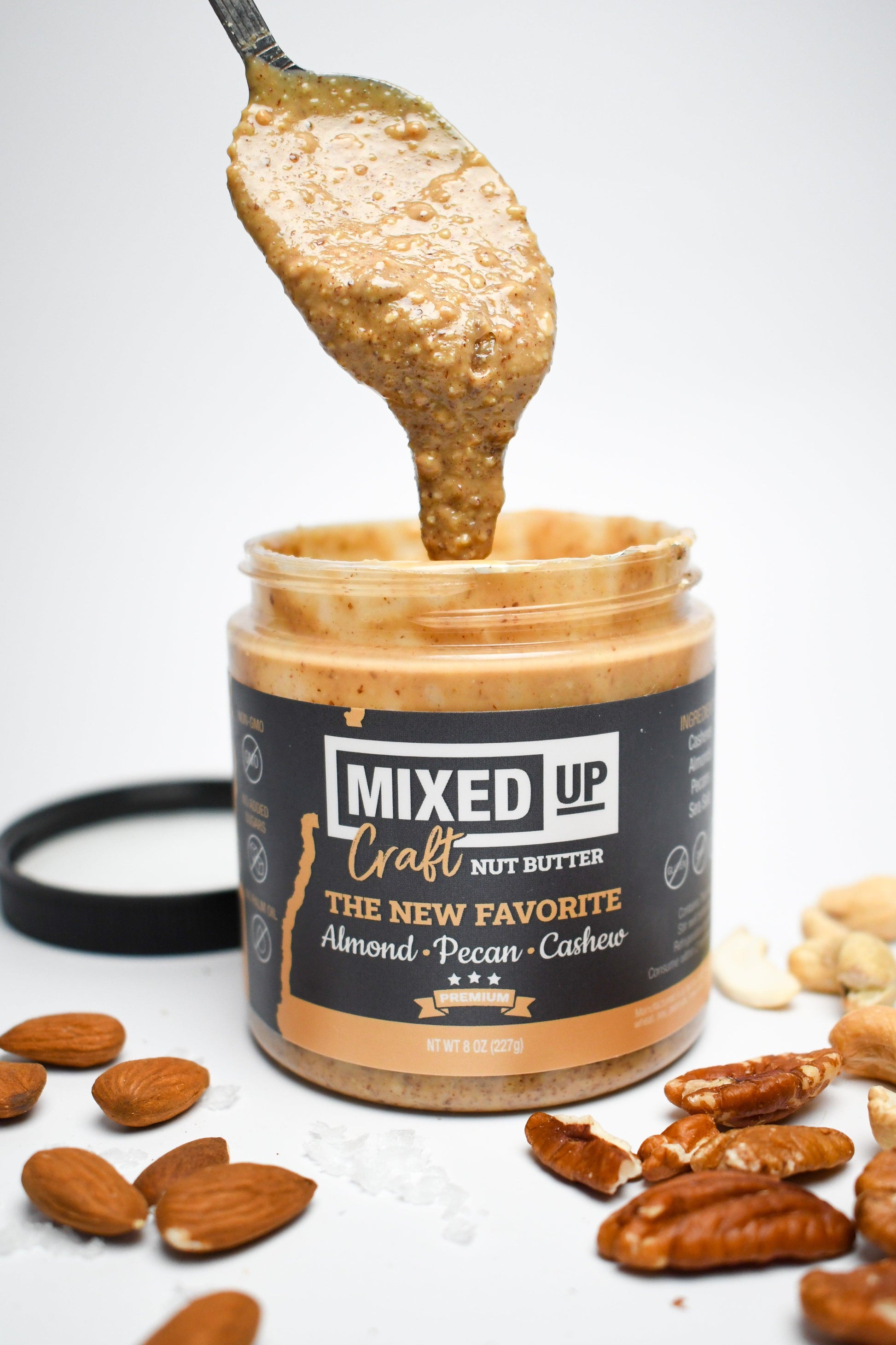 Creamy almond, pecan, and cashew nut butter from Mixed Up Foods in an 8 oz jar, showcasing a smooth, nutty spread.