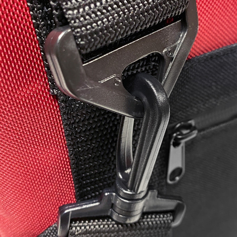 Red nylon soft cooler from Polar Bear Coolers, 12-pack, showing the insulated exterior and carrying handles.
