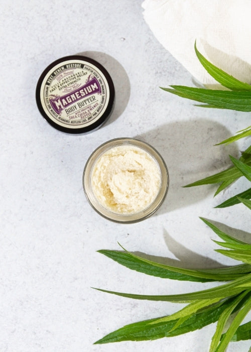 Creamy magnesium body butter from Roots and Leaves LLC, showing a jar of soothing, rich moisturizer for skin hydration.