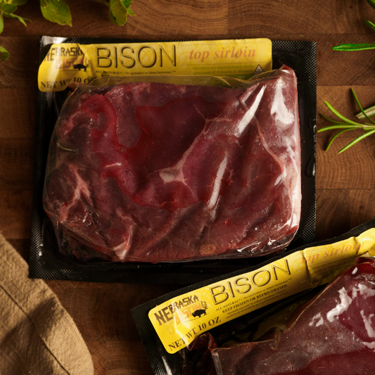 Nebraska Bison Top Sirloin Steaks, 4 cuts of 10 oz each, raw meat with marbling, ready for grilling or cooking.