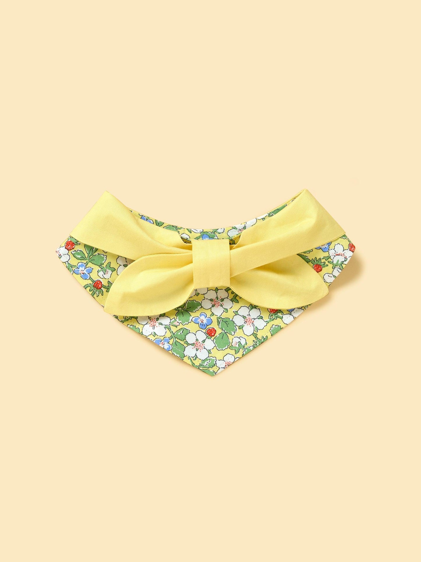 Yellow floral bandana for babies featuring a bowtiful garden design by BarkBarkBaby, with colorful butterfly and flower patterns.