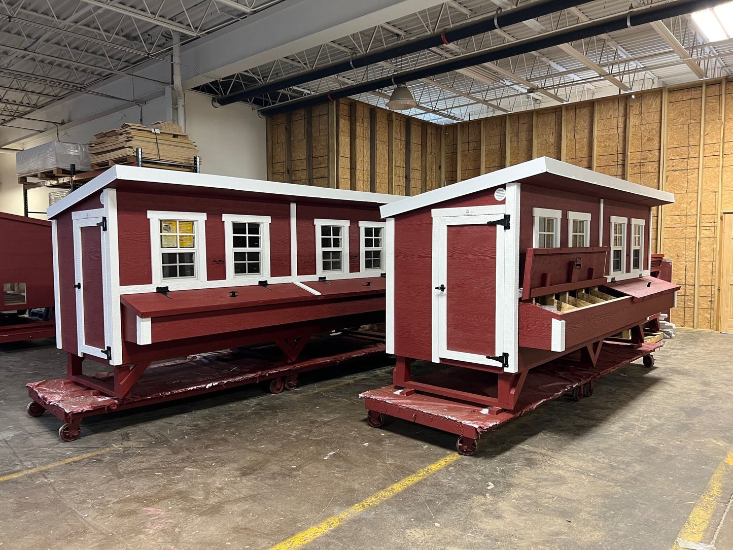 Two OverEZ Jumbo Chicken Coops designed for up to 30 chickens, featuring spacious outdoor runs and sturdy construction.