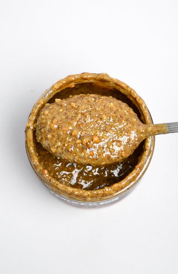 Creamy almond, pecan, and cashew nut butter from Mixed Up Foods in an 8 oz jar, showcasing a smooth, nutty spread.