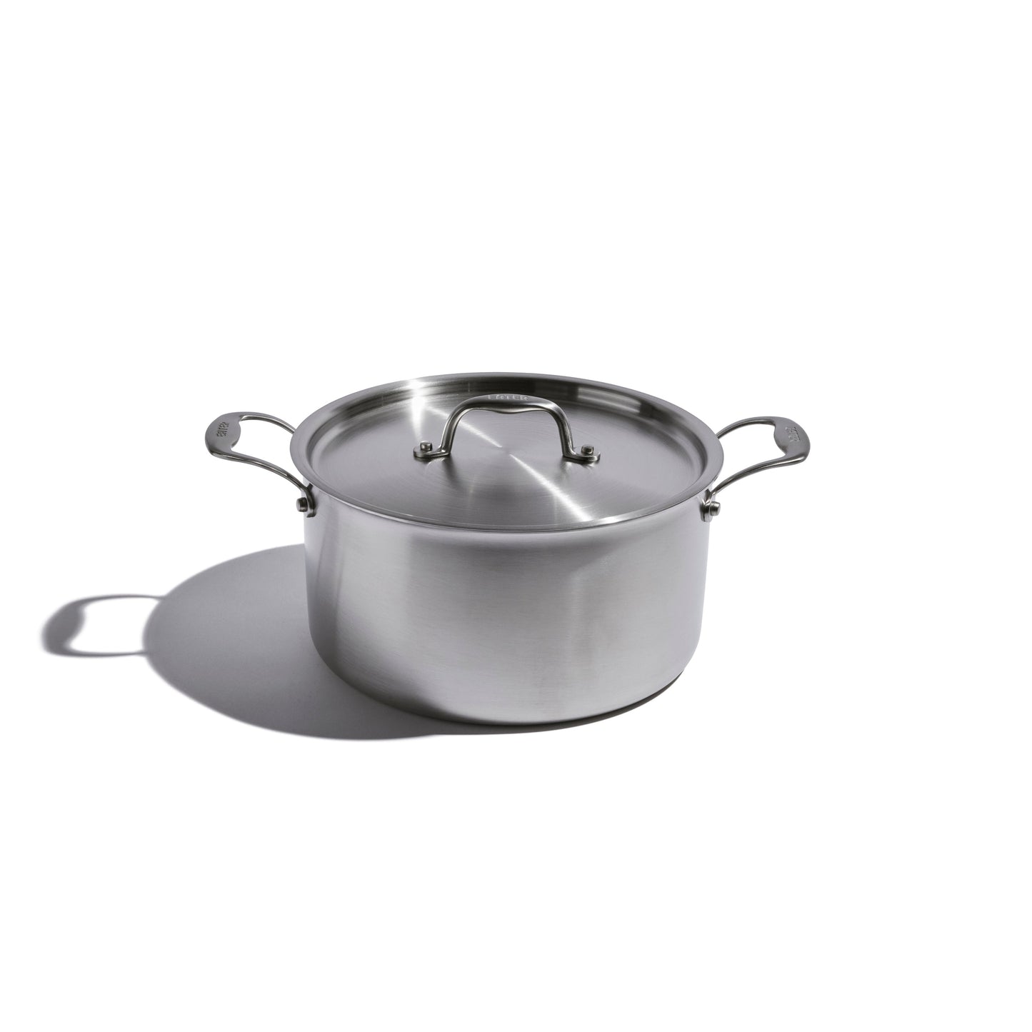 Heritage Steel 8-quart stock pot with lid, durable stainless steel cookware for soups, stews, and large meal preparation.