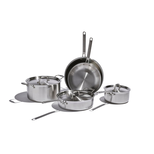 Heritage Steel Eater 8-piece cookware set with stainless steel pots and pans arranged on a kitchen countertop.