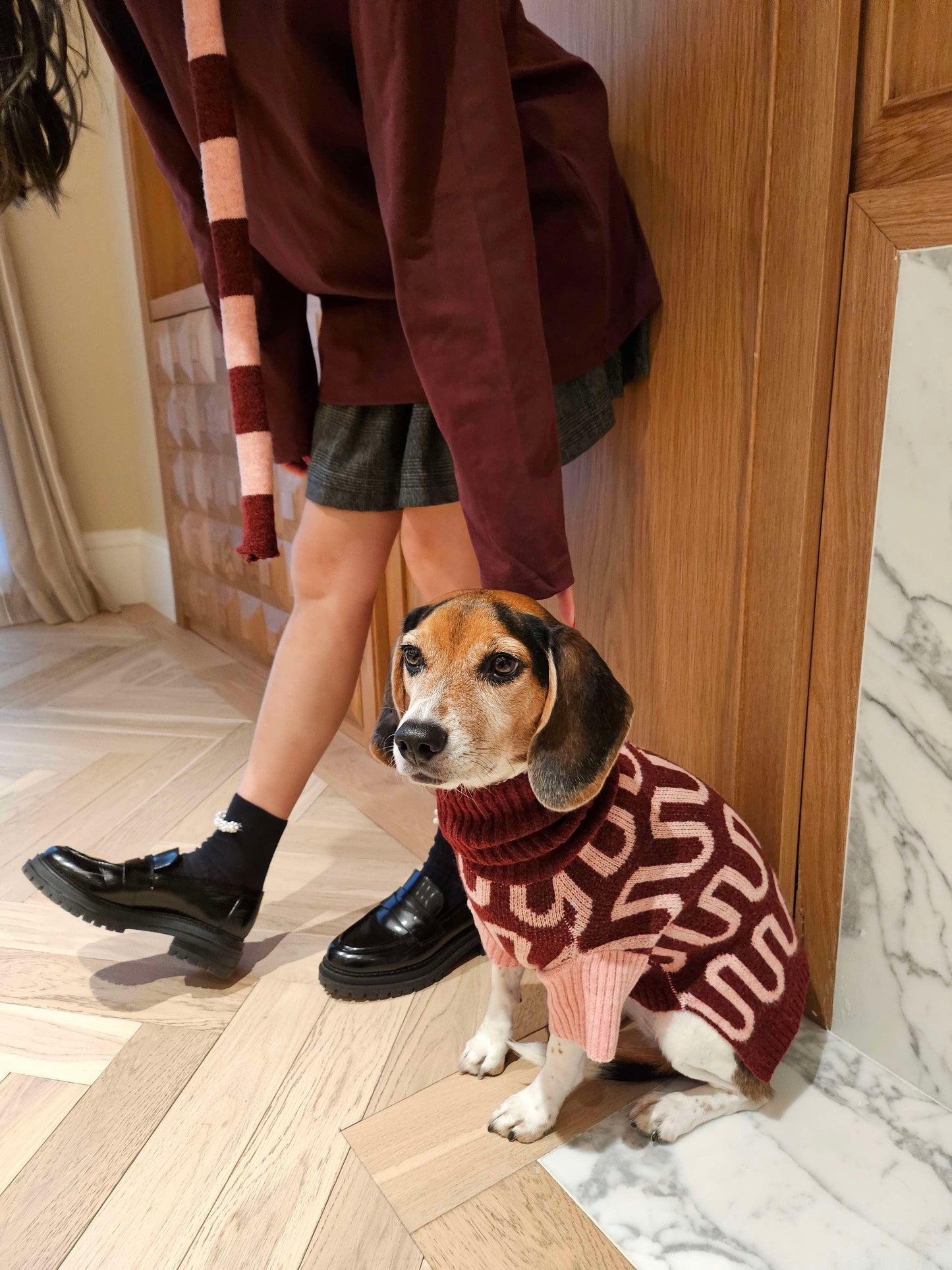 Pink and white striped BarkBarkBaby Rosé Bliss Thin Useless scarf draped over a surface, showcasing its lightweight, soft fabric.